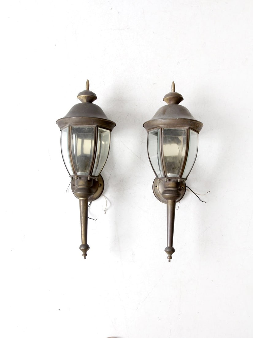 Vintage Pair of Weathered Bronze Outdoor Wall Sconces: Vintage Pair of Weathered Bronze Outdoor Wall Sconces Enhance your outdoor spaces with this pair of vintage outdoor wall sconces featuring a classic coach light design. Each sconce showcases a tapered