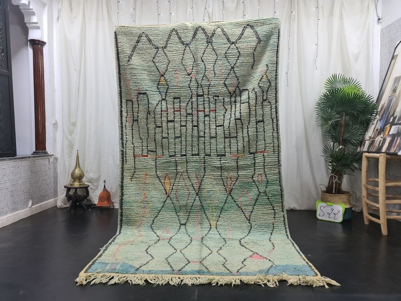 Handmade Green Moroccan Berber Wool Rug 10 x 5 Feet: Handmade Green Moroccan Berber Wool Rug 10 x 5 Feet Transform your space with this Elegant Artistic Green Handmade Moroccan Berber Wool Rug. Crafted by skilled women weavers from the Atlas Mountains,