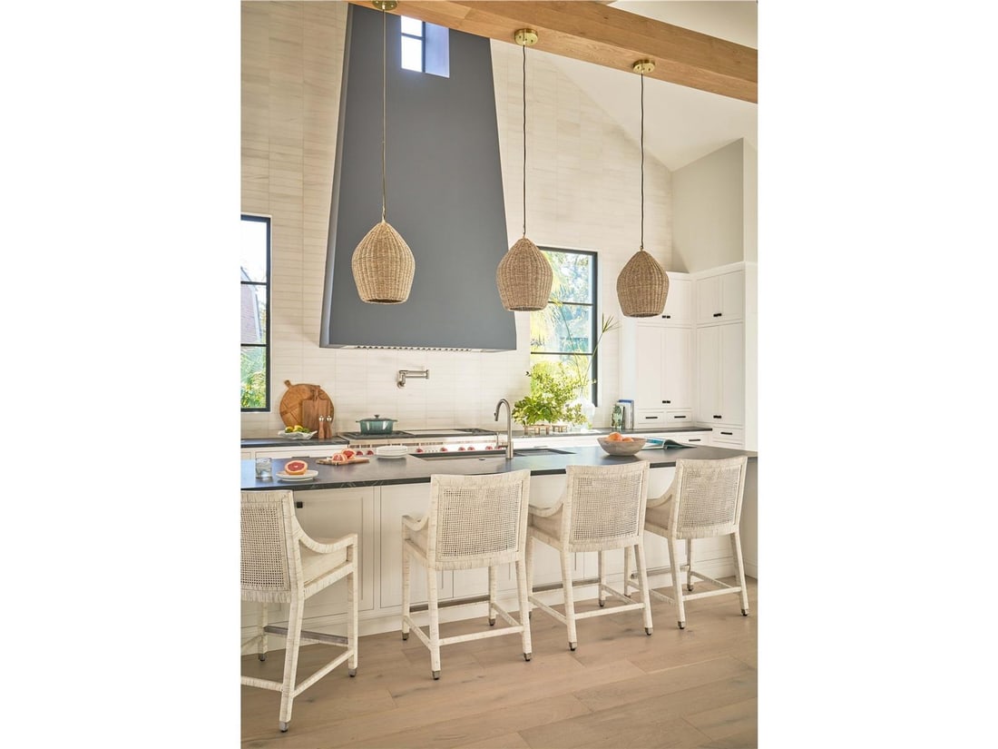 Universal Weekender Coastal Living Rattan Chair in Nomad Snow White: Universal Weekender Coastal Living Rattan Chair in Nomad Snow White Enhance your living space with this stylish Coastal Rattan Chair, meticulously designed for modern homes. Featuring a fresh Nomad Sn