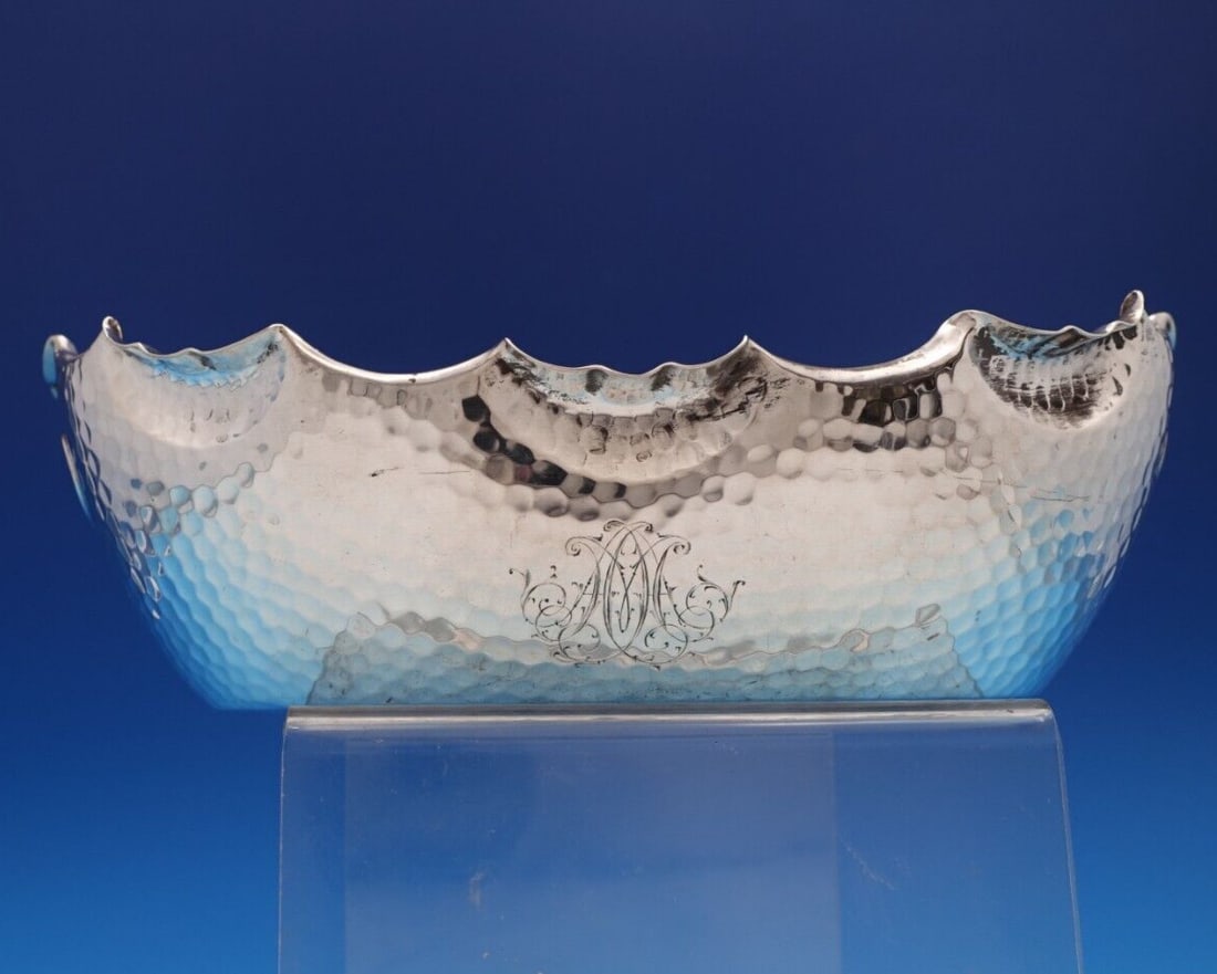 German .800 Silver Hammered Bowl with Ruffled Edge 9.5" Long: German .800 Silver Hammered Bowl with Ruffled Edge 9.5" Long This exquisite German .800 silver bowl showcases a stunning hammered aesthetic with elegantly ruffled edges. Designed in an oval shape, the