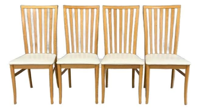 Set of 4 Italian Modern Beech Dining Chairs 1980s: Set of 4 Italian Modern Beech Dining Chairs 1980s This set of four Italian Modern dining chairs features a mid-century design crafted from solid beech wood with off-white seats. Made in Italy during t
