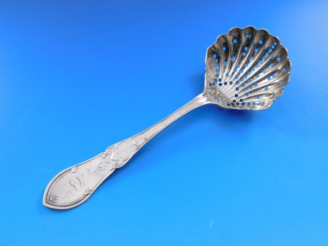 Rare Shiebler Dew Drop Sterling Silver Sugar Sifter 7 1/8" Shell Bowl: Rare Shiebler Dew Drop Sterling Silver Sugar Sifter 7 1/8" Shell Bowl Discover a rare piece of history with this Dew Drop sugar sifter from Shiebler, crafted in sterling silver. This exquisite spoon f