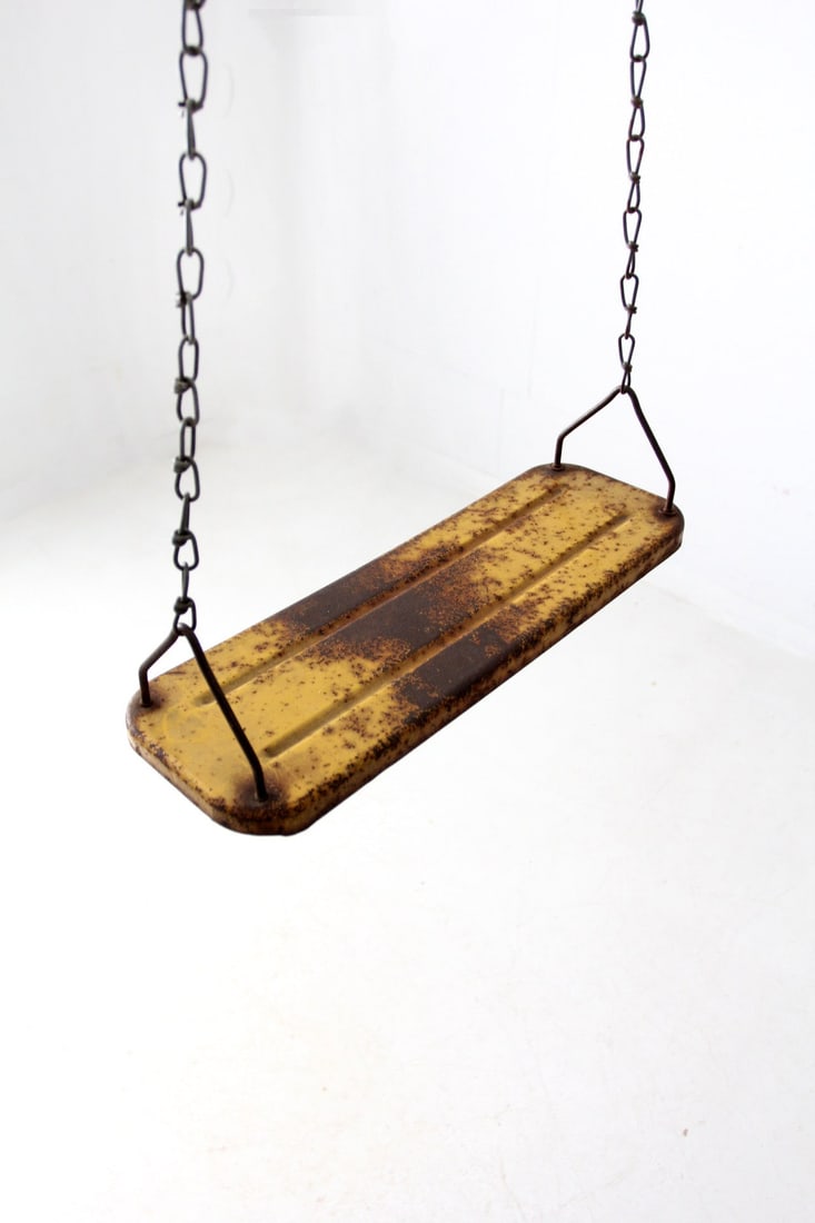 Vintage Mid-Century Metal Swing Rusty Yellow Finish Garden Decor: Vintage Mid-Century Metal Swing Rusty Yellow Finish Garden Decor This vintage mid-century metal swing showcases a striking rusty yellow finish complemented by classic indented stripe detailing on the