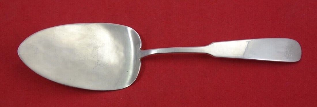 Erickson Silver Chino Sterling Silver Pie Server 8 3/4": Erickson Silver Chino Sterling Silver Pie Server 8 3/4" This exquisite pie server from the Chino pattern by Erickson Silver is crafted from high-quality sterling silver. Measuring 8 3/4" in length, it