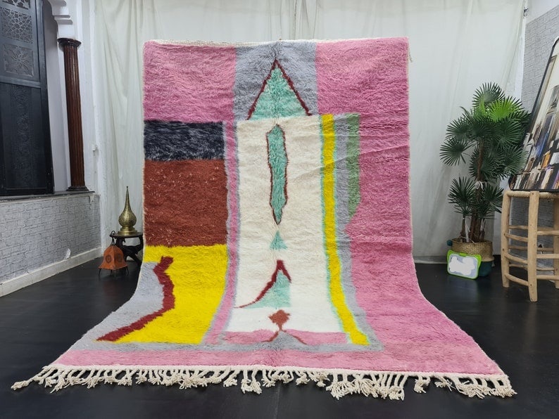 Handmade Pink Moroccan Berber Wool Rug 9.84 x 6.56 Feet: Handmade Pink Moroccan Berber Wool Rug 9.84 x 6.56 Feet Enhance your space with this stunning Pink Handmade Moroccan Berber Area Wool Rug. Handwoven by local Berber women in the Middle Atlas Mountains