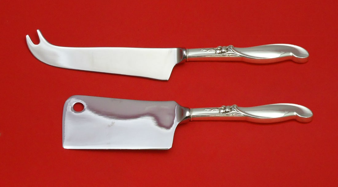 International Sterling Silver Silver Melody Cheese Serving Set 2P: International Sterling Silver Silver Melody Cheese Serving Set 2P Enhance your entertaining experience with this exquisite Silver Melody Cheese Serving Set by International Sterling. This two-piece ho