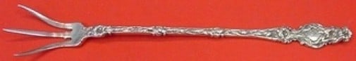 Whiting Sterling Silver Lettuce Fork 8 3/4" Lily Pattern: Whiting Sterling Silver Lettuce Fork 8 3/4" Lily Pattern This exquisite lettuce fork, crafted by Whiting, showcases the elegant Lily pattern. Made of high-quality sterling silver, it measures 8 3/4 in