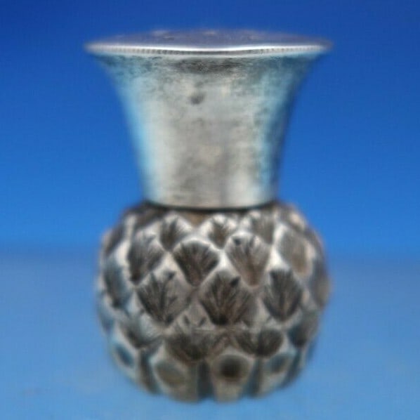 Sheffield Sterling Silver Pepper Shaker Thistle by GW 1899: Sheffield Sterling Silver Pepper Shaker Thistle by GW 1899 This exquisite English sterling silver pepper shaker features a beautiful thistle design, crafted by GW (George Wish) in Sheffield, England,