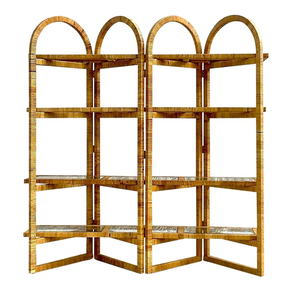Vintage Coastal Arched Rattan Etagere from Palm Beach Estate: Vintage Coastal Arched Rattan Etagere from Palm Beach Estate Discover a stunning vintage coastal etagere, expertly crafted from wrapped rattan. This piece features an elegant arched design with a chic