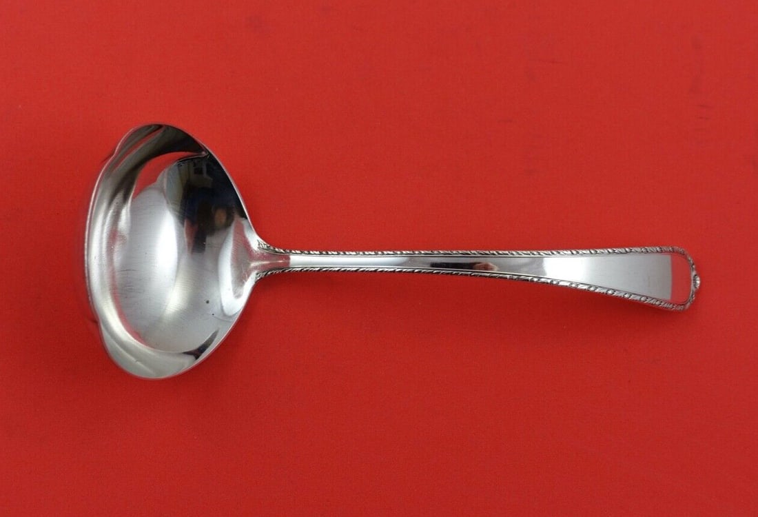 International Sterling Silver Gravy Ladle Pine Tree Pattern 6 1/4": International Sterling Silver Gravy Ladle Pine Tree Pattern 6 1/4" This exquisite gravy ladle features the timeless Pine Tree pattern by International Sterling. Crafted from high-quality sterling silv