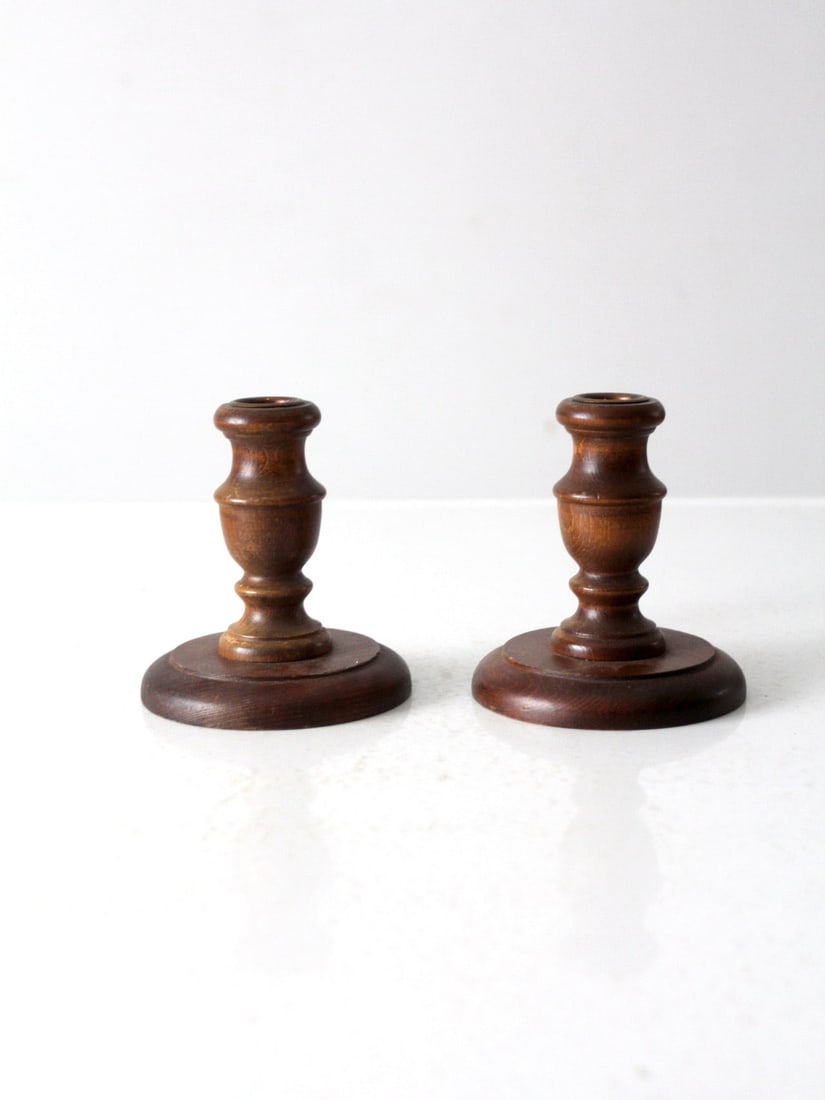 Pair of Vintage Wooden Candle Holders for Standard Taper: Pair of Vintage Wooden Candle Holders for Standard Taper This pair of vintage wooden candle holders showcases a classic turned wood design, perfect for holding standard taper candles. They reflect a c