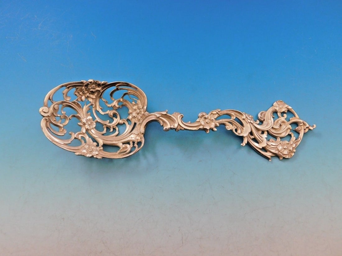 Tiffany & Co. Sterling Silver Ice Spoon Pierced Flowers 7 3/4 in: Tiffany & Co. Sterling Silver Ice Spoon Pierced Flowers 7 3/4 in This exquisite ice spoon from Tiffany & Co. is crafted from high-quality sterling silver and features an elegant design adorned with pi