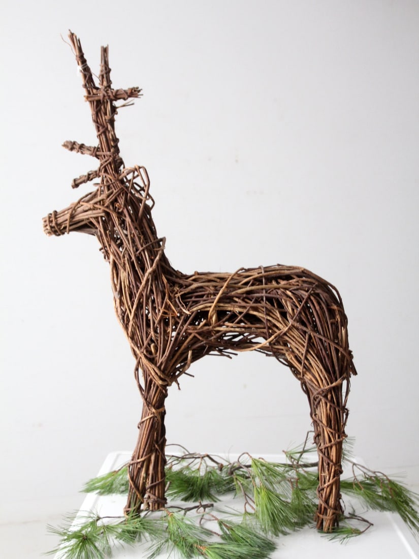 Vintage Wicker Reindeer Sculpture 35in Tall Organic Design: Vintage Wicker Reindeer Sculpture 35in Tall Organic Design Enhance your home decor with this vintage wicker reindeer sculpture, featuring an elegant and organic silhouette crafted from woven branches.