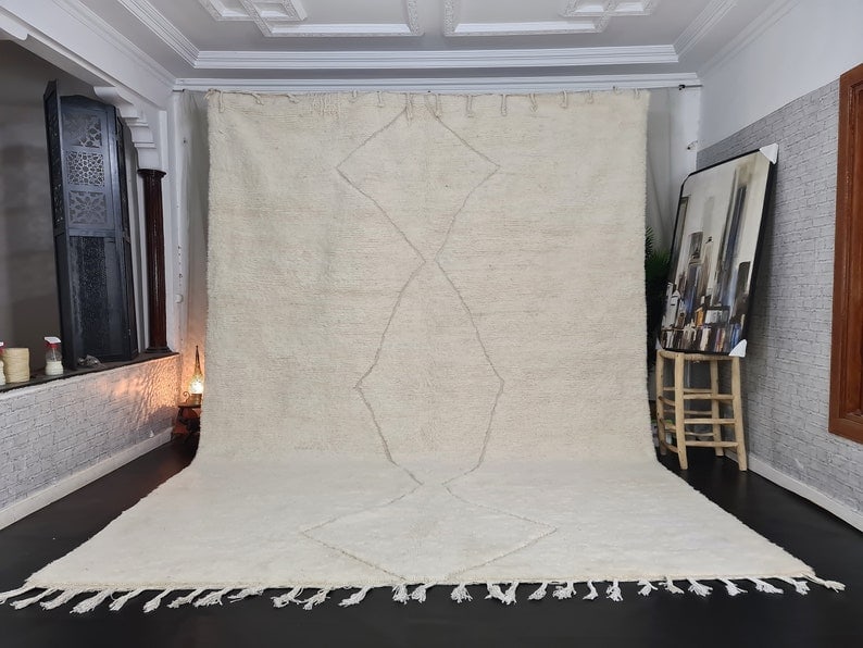Authentic Large Handmade Moroccan Berber Wool Rug 13 x 6.56 Feet: Authentic Large Handmade Moroccan Berber Wool Rug 13 x 6.56 Feet Elevate your living space with this large, authentic Moroccan Berber wool rug, featuring a stunning white color and an engraved geometr