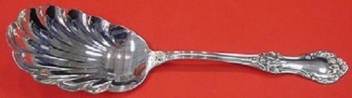 International Sterling Wild Rose Berry Spoon Shell 9.25 inches: International Sterling Wild Rose Berry Spoon Shell 9.25 inches This beautiful Wild Rose Berry Spoon by International Sterling is crafted from high-quality sterling silver. The elegant shell design mea