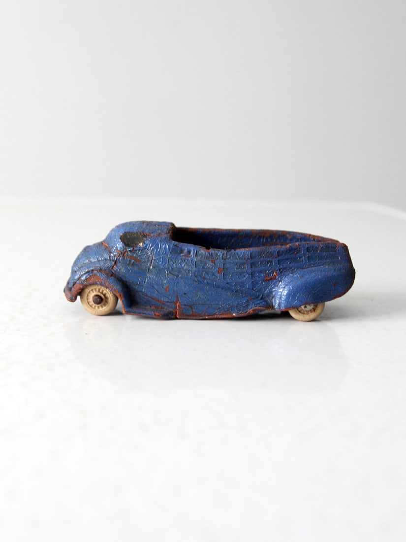 1930s Vintage Sun Rubber Toy Car Sky Blue Collectible: 1930s Vintage Sun Rubber Toy Car Sky Blue Collectible Step back into the 1930s with this charming vintage toy car from the Sun Rubber Company. Dressed in a delightful sky blue paint, this little rubbe