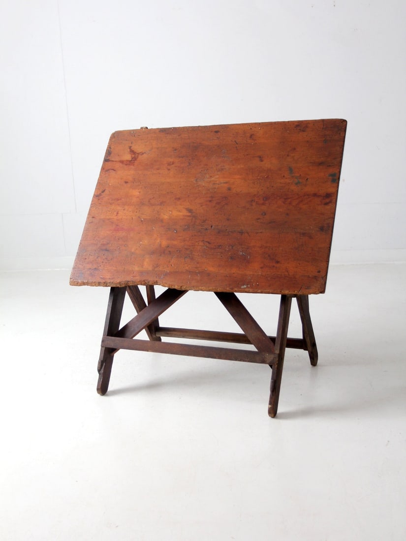 Vintage Antique Drafting Table with Adjustable Tilting Top: Vintage Antique Drafting Table with Adjustable Tilting Top This exquisite antique drafting table, dating back to the late 1800s to early 1900s, showcases a classic design with a versatile tilting top.