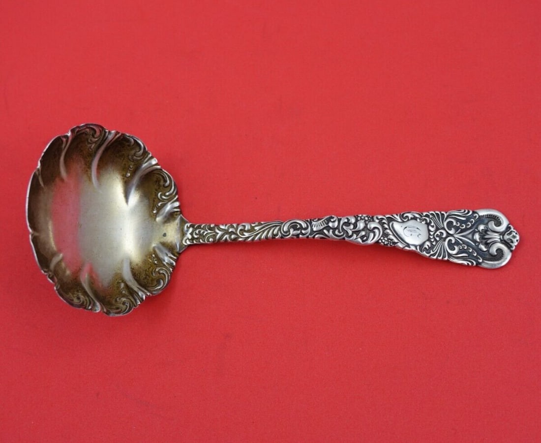 Watrous Dresden Sterling Silver Gravy Ladle with Gold Wash 6 5/8": Watrous Dresden Sterling Silver Gravy Ladle with Gold Wash 6 5/8" This exquisite gravy ladle is a stunning piece from the Dresden pattern by Watrous, crafted from fine sterling silver. Measuring 6 5/8
