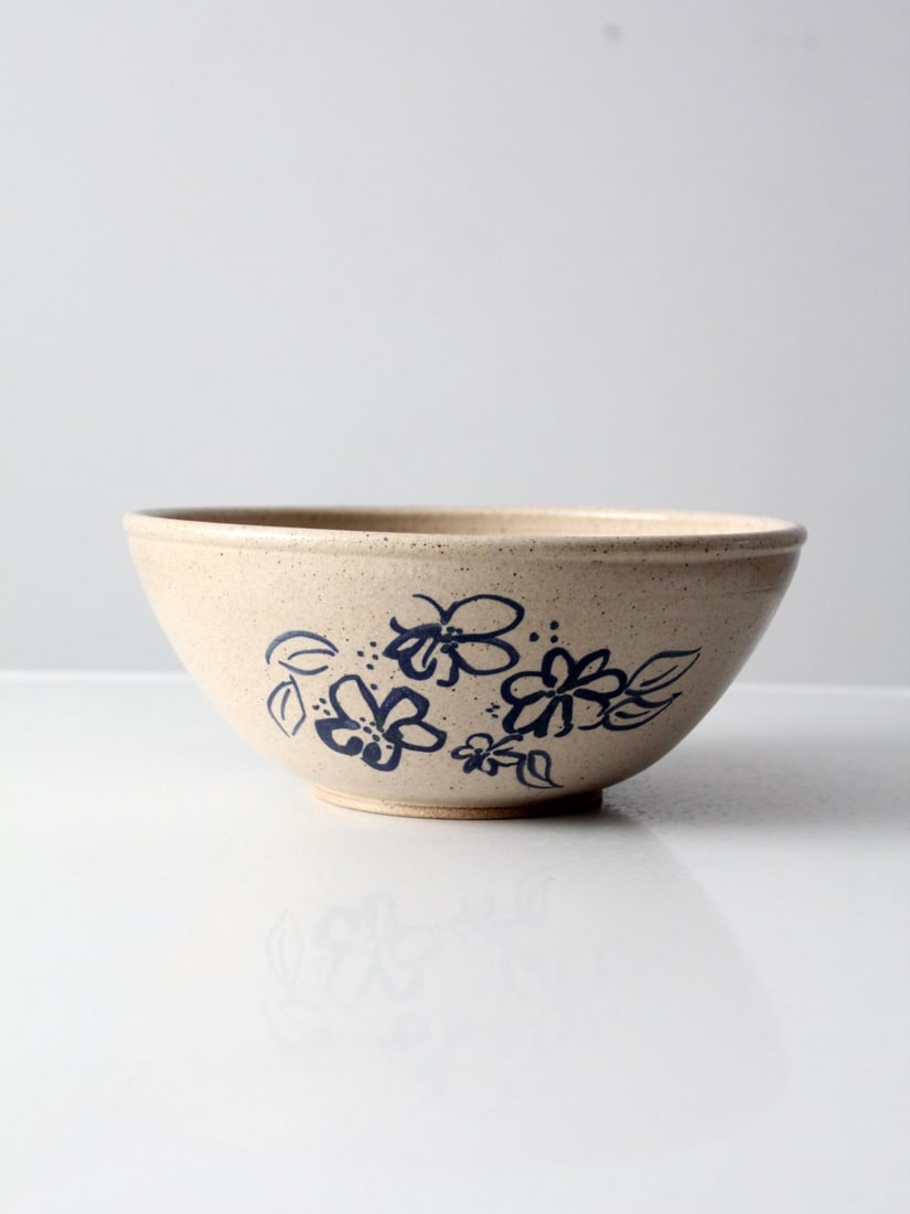 Vintage Alan Jones Studio Pottery Bowl 11 Inch 1991 with Blue Flowers: Vintage Alan Jones Studio Pottery Bowl 11 Inch 1991 with Blue Flowers Discover the charm of this vintage Alan Jones studio pottery bowl, crafted in 1991. This hand-crafted bowl features a beautiful ta