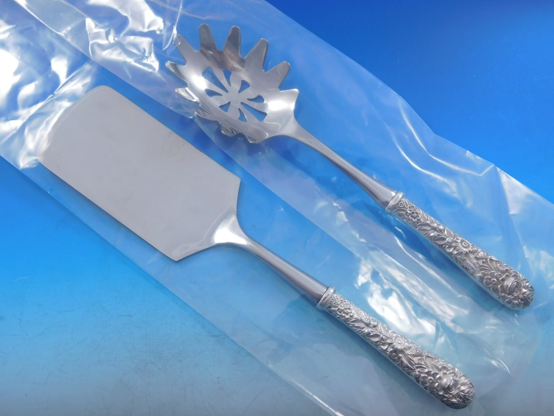 Kirk Repousse Sterling Silver 2pc Italian Pasta Server Set: Kirk Repousse Sterling Silver 2pc Italian Pasta Server Set Elevate your dining experience with this exquisite 2-piece Italian Pasta Server Set by Kirk, featuring the elegant Repousse pattern. Crafted