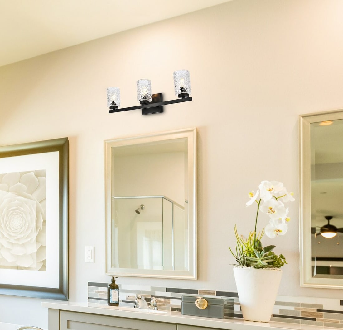 Cassie 3 Light Wall Sconce Black Frame with Glass Shades: Cassie 3 Light Wall Sconce Black Frame with Glass Shades Illuminate your space with this modern wall sconce featuring a sleek black frame and clear glass shades. This versatile light fixture can enhan