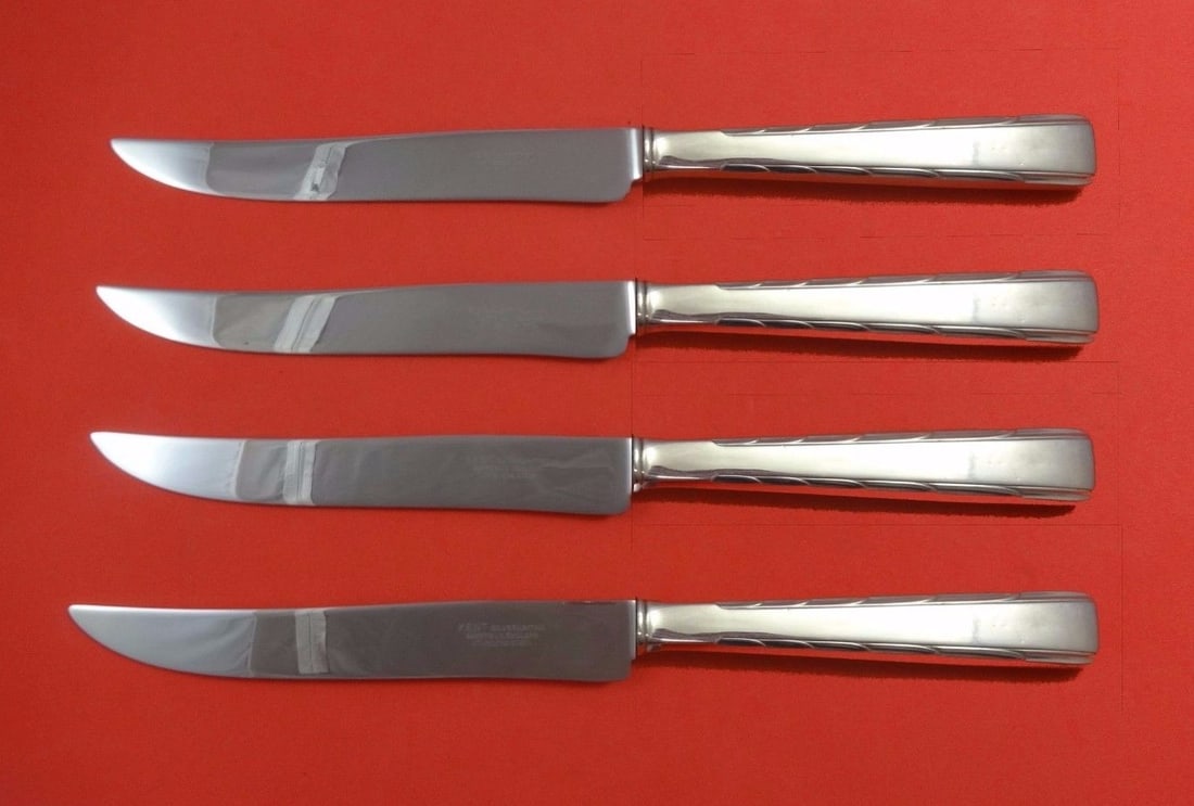 Easterling Horizon Sterling Silver Steak Knife Set 4pc Texas Sized: Easterling Horizon Sterling Silver Steak Knife Set 4pc Texas Sized Elevate your dining experience with this stunning 4-piece steak knife set from the Horizon by Easterling collection. Crafted from ste