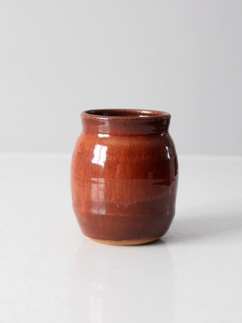 P Clark Signed Vintage Studio Pottery Vase with Russet Glaze: P Clark Signed Vintage Studio Pottery Vase with Russet Glaze This vintage studio pottery vase is a charming piece, showcasing the craftsmanship of artist P. Clark. The vase features a beautiful warm r