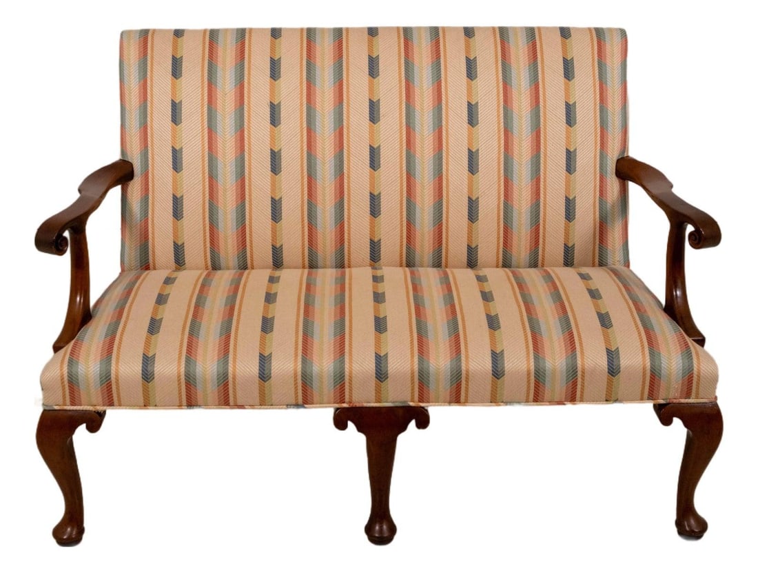 Mahogany Six-Leg Settee Colonial Williamsburg Queen Anne Inspired Design: Mahogany Six-Leg Settee Colonial Williamsburg Queen Anne Inspired Design This elegant Queen Anne style settee is crafted from mahogany and features six cabriole legs with scroll-like wings and pad fee