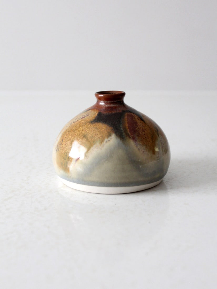 Artisan Vintage Pottery Vase Gourd Form Ash Glaze 3.5 Inch: Artisan Vintage Pottery Vase Gourd Form Ash Glaze 3.5 Inch This vintage studio pottery vase features a captivating sculptural gourd-like form, enhanced by a richly layered ash glaze. The warm, earthy