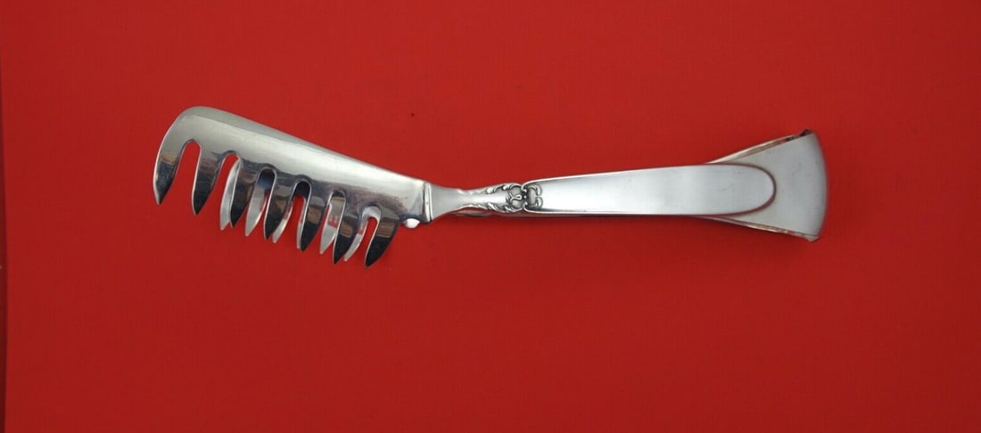 Camusso Portofino Sterling Silver Pasta Serving Tong 10 inch: Camusso Portofino Sterling Silver Pasta Serving Tong 10 inch Discover the elegance of the Portofino Pasta Server Tong by Camusso, crafted from high-quality sterling silver. This exquisite serving piec