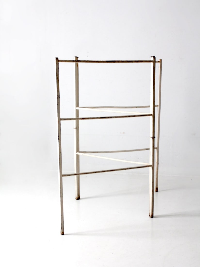 Antique White Wash Folding Drying Rack with Spindle Bars: Antique White Wash Folding Drying Rack with Spindle Bars This antique white wash drying rack is a charming and functional addition to any home. Crafted from painted wood, it features tri-fold arms wit