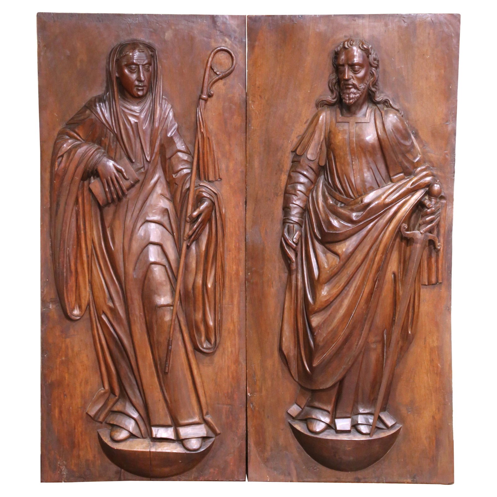 17th Century French Walnut Panels Saint Paul Saint Teresa Set of 2: 17th Century French Walnut Panels Saint Paul Saint Teresa Set of 2 This exquisite pair of late 17th-century French walnut panels showcases the revered figures of Saint Paul the Apostle and Saint Teres