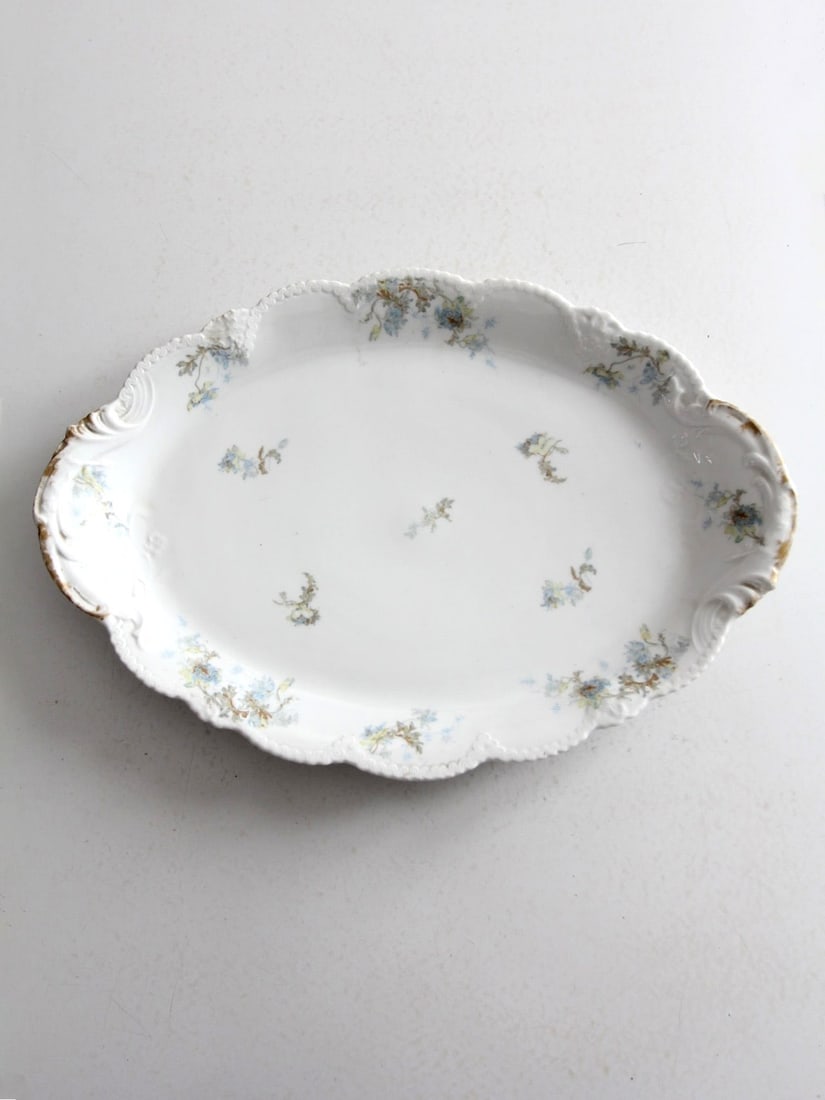 1895 Antique Haviland Limoges Floral Porcelain Platter with Gold Accents: 1895 Antique Haviland Limoges Floral Porcelain Platter with Gold Accents This exquisite antique Haviland Limoges platter features a charming blue floral Schleiger pattern adorned with elegant gold-pai
