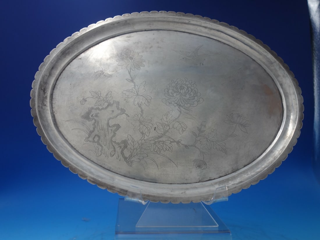 Antique Chinese Sterling Silver Serving Plate with Engraved Chrysanthemums and Dragonfly: Antique Chinese Sterling Silver Serving Plate with Engraved Chrysanthemums and Dragonfly This exquisite Chinese sterling silver oval serving plate showcases intricate hand-engraved designs featuring c