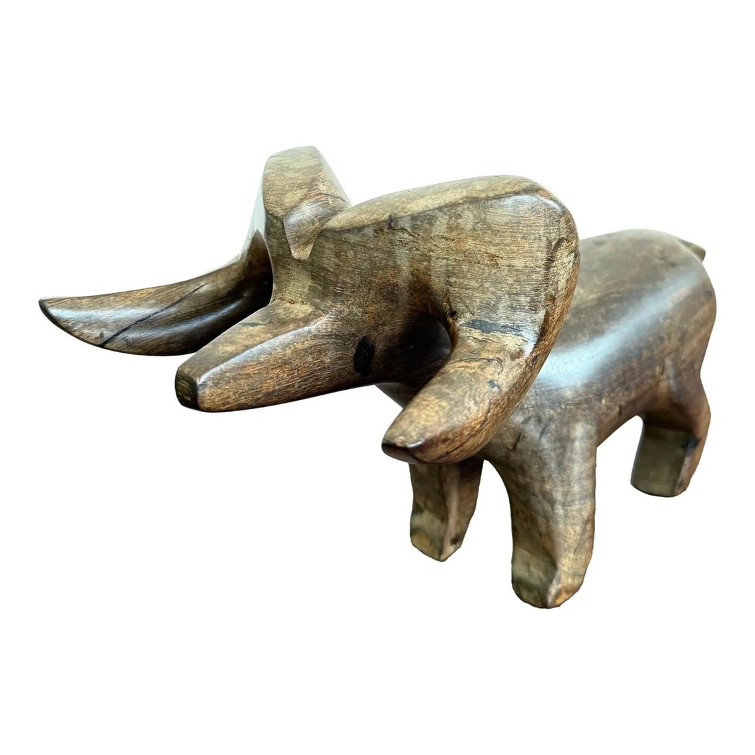 Vintage Hand-Carved Wooden Ram Figurine Folk Art Decor: Vintage Hand-Carved Wooden Ram Figurine Folk Art Decor Discover a striking vintage hand-carved wooden ram figurine that showcases bold, stylized curves and a compact form. The abstract shape emphasize