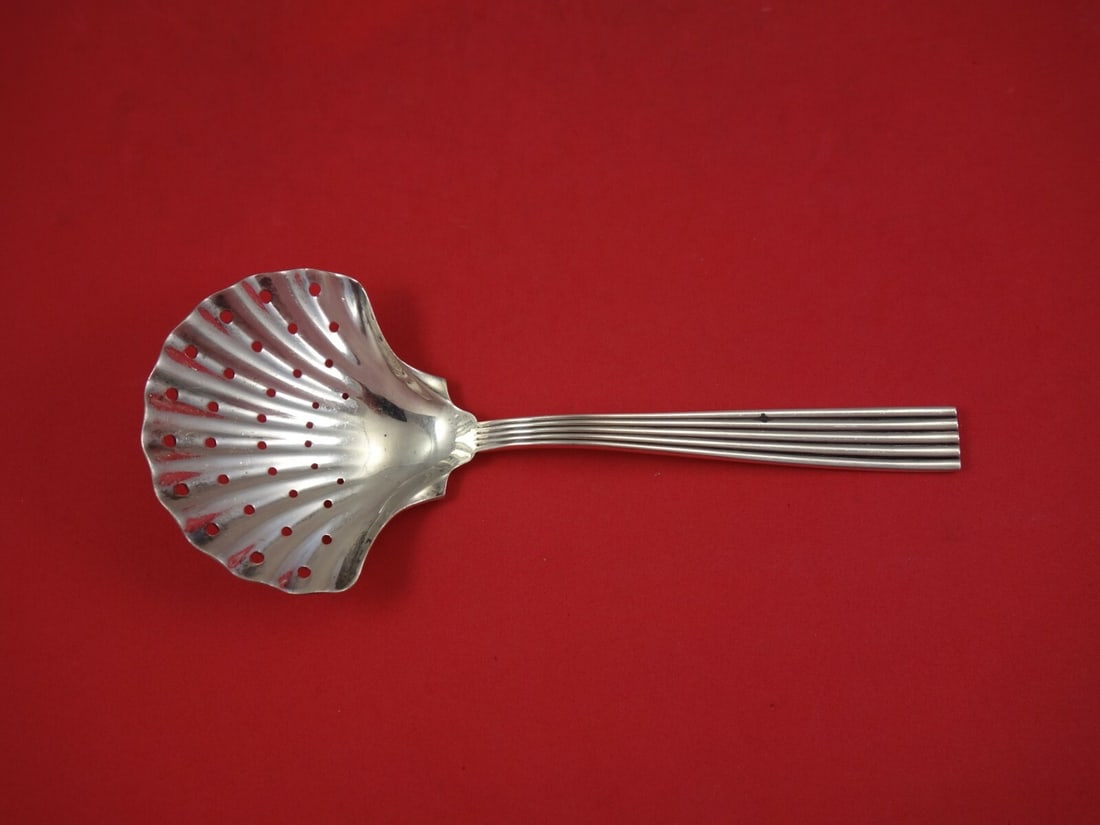 Buccellati Tiber Sterling Silver 8.25" Pierced Shell Pea Spoon: Buccellati Tiber Sterling Silver 8.25" Pierced Shell Pea Spoon This exquisite Tiber pea spoon by Buccellati showcases a beautifully pierced shell bowl, crafted from high-quality sterling silver. Measu