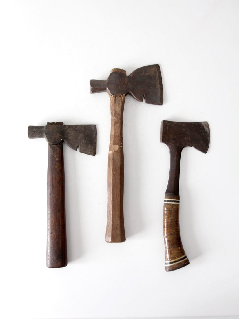 Antique Hatchet Collection Early 1900s Sportsman's Camp Tools: Antique Hatchet Collection Early 1900s Sportsman's Camp Tools This antique trio of hatchets showcases the evolution of small axe design from the late 1800s to the mid-1900s. The left hatchet is a carp