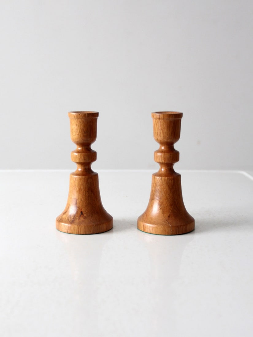 Charming Vintage Handmade Wooden Candlestick Holders Pair: Charming Vintage Handmade Wooden Candlestick Holders Pair Enhance your decor with this charming pair of vintage handmade wooden candlestick holders. Crafted from wood, these candlesticks exhibit a war