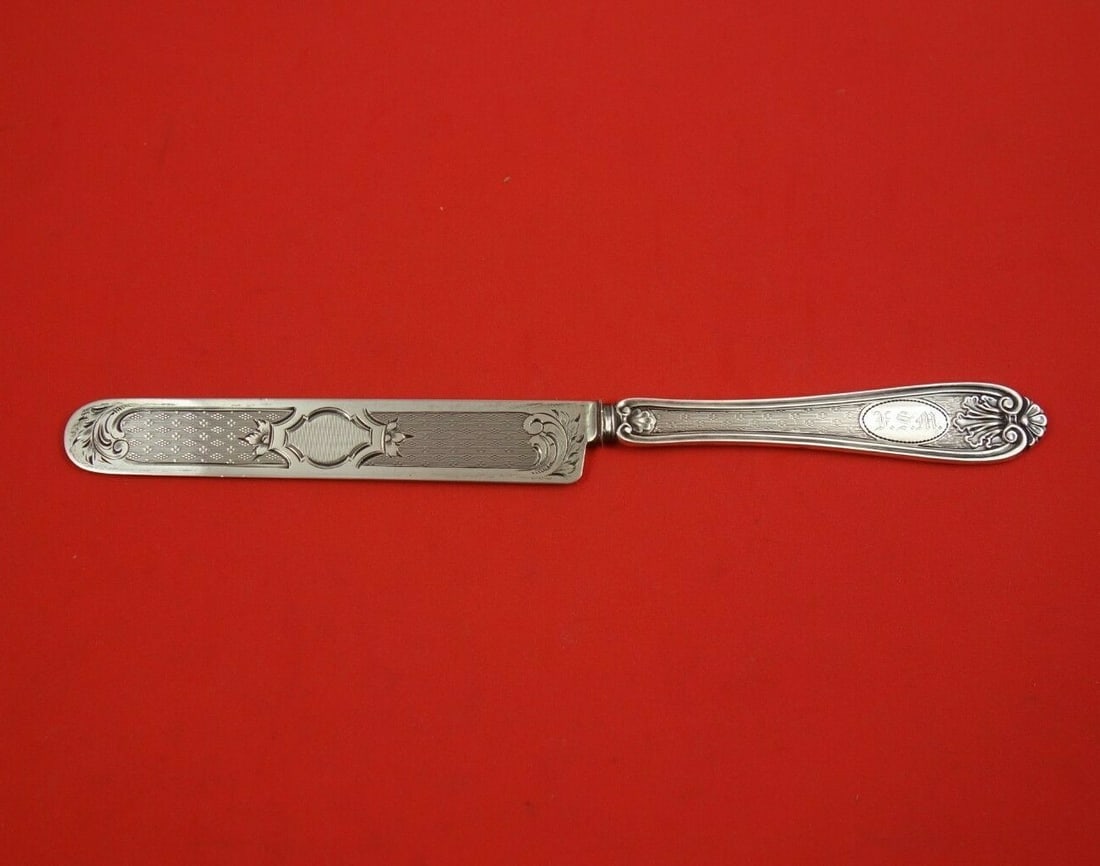 Tifft Whiting Sterling Silver Leaf & Shell Tea Knife 8 1/4" Engine Turned: Tifft Whiting Sterling Silver Leaf & Shell Tea Knife 8 1/4" Engine Turned This exquisite tea knife features a flat handle design crafted from sterling silver, showcasing the elegant Leaf and Shell pat