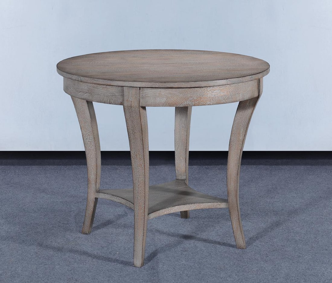 Ballard Greige Round Side Table with Tapered Legs: Ballard Greige Round Side Table with Tapered Legs Introducing the Chic Ballard Greige Side Table, a beautifully designed piece that seamlessly blends with transitional decor. This round side table fea