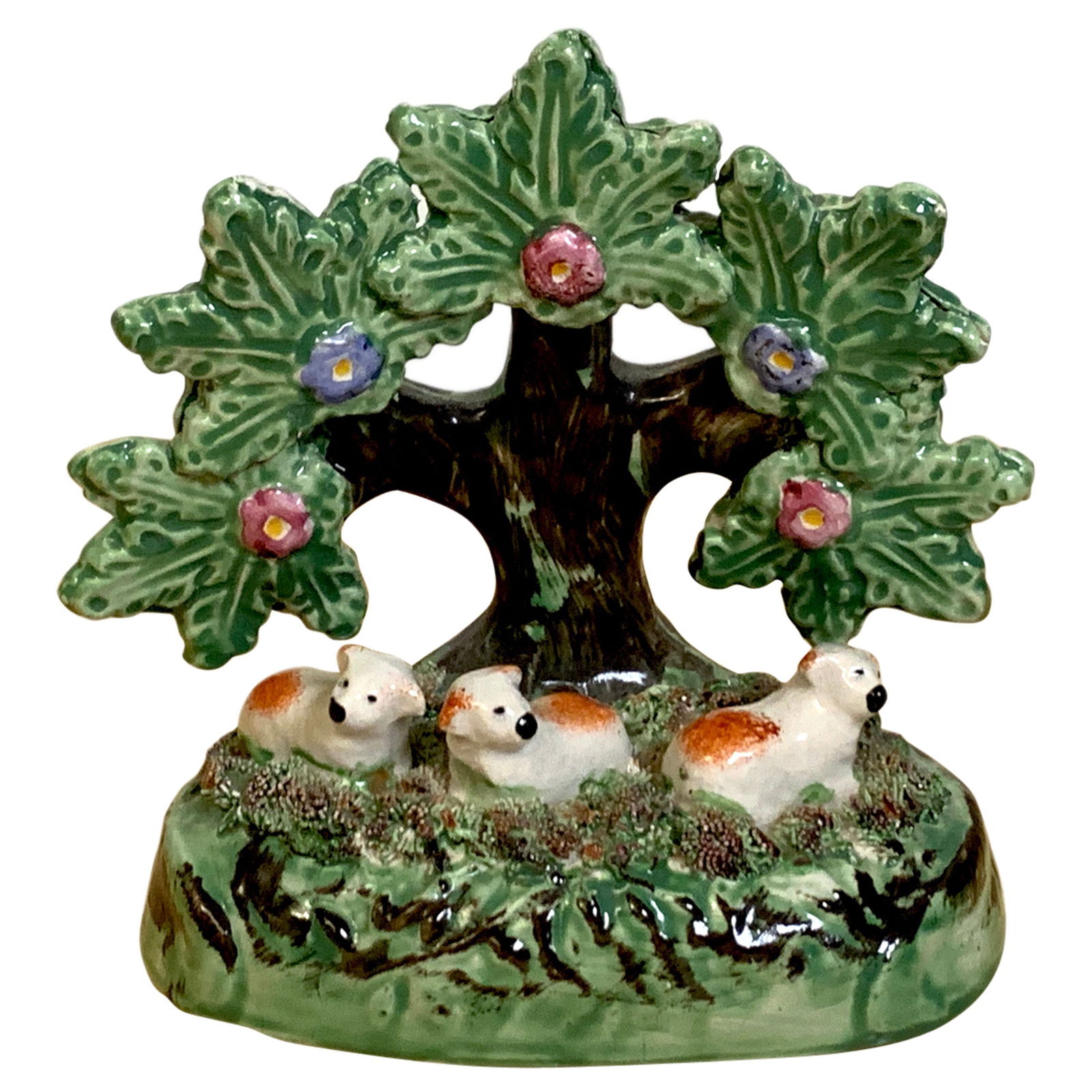 19th Century Staffordshire Pearlware Red Spaniel Puppies Bocage: 19th Century Staffordshire Pearlware Red Spaniel Puppies Bocage This exquisite Staffordshire Pearlware bocage features a charming grouping of three seated red and white spaniel puppies under a tree, e