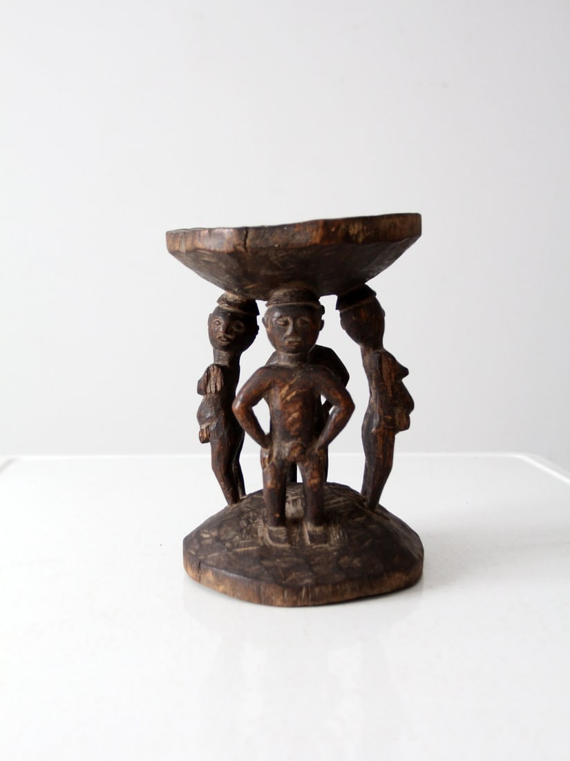 Luba Tribe Vintage African Tribal Art Stool: Luba Tribe Vintage African Tribal Art Stool Discover a stunning vintage African tribal art stool, intricately crafted from wood and featuring a unique figurative design that depicts two men and two wo