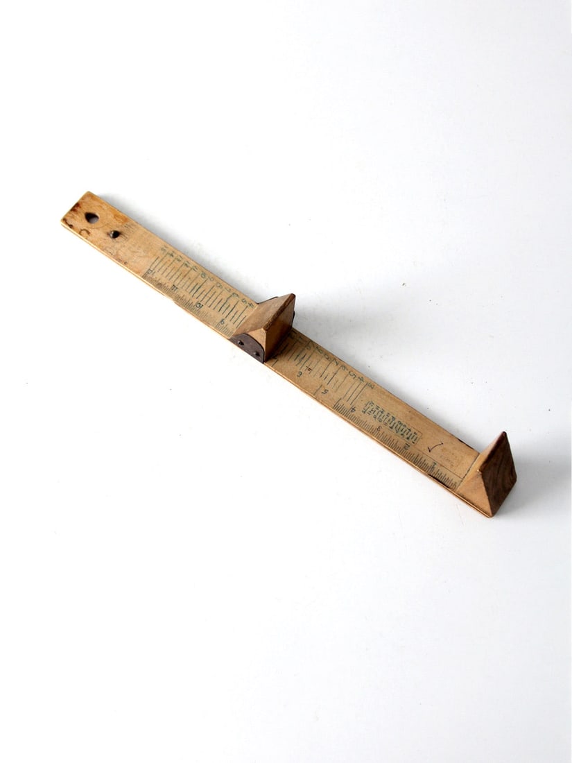 Vintage Dr. Scholl's 1940s Wooden Foot Size Indicator Tool: Vintage Dr. Scholl's 1940s Wooden Foot Size Indicator Tool Discover a unique piece of history with this vintage Dr. Scholl's shoe sizing tool from the 1940s. Crafted from wood, this slide ruler is des