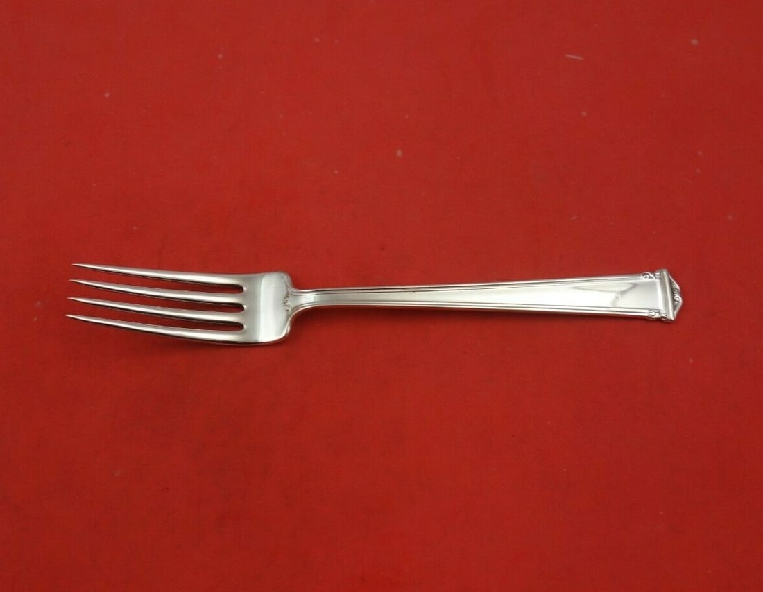 International Sterling Silver Fork Theseum Pattern 7 1/4 Inches: International Sterling Silver Fork Theseum Pattern 7 1/4 Inches Discover the elegance of the Theseum pattern with this exquisite sterling silver regular fork by International. Measuring 7 1/4 inches,