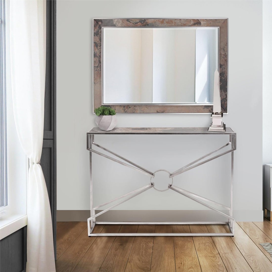 Howard Elliott Polished Silver Stainless Steel Square Obelisk 20.25H: Howard Elliott Polished Silver Stainless Steel Square Obelisk 20.25H Elevate your modern decor with this stunning polished silver obelisk. Crafted from high-quality stainless steel, this sleek and sty