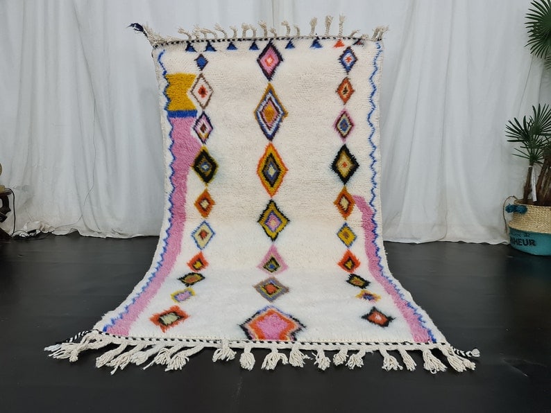 Handmade Moroccan Wool Rug Soft White Colorful Design 6.56 x 3.28 Feet: Handmade Moroccan Wool Rug Soft White Colorful Design 6.56 x 3.28 Feet Experience the charm of this Beautiful Soft Handmade Moroccan Wool Rug. This exquisite white rug features vibrant colorful shapes