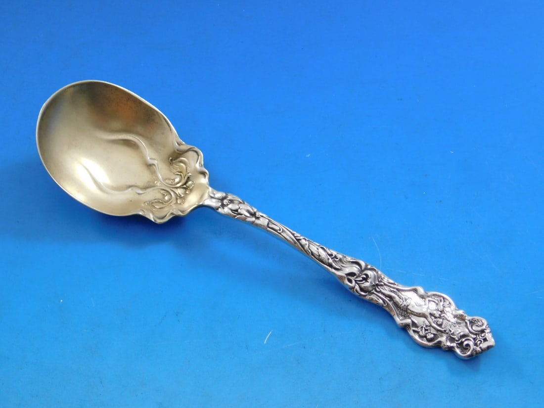 Wallace Irian Sterling Silver Gold Washed Sugar Spoon 6 1/8": Wallace Irian Sterling Silver Gold Washed Sugar Spoon 6 1/8" Experience the elegance of the Irian pattern with this exquisite sterling silver sugar spoon by Wallace. Measuring 6 1/8 inches, this servi