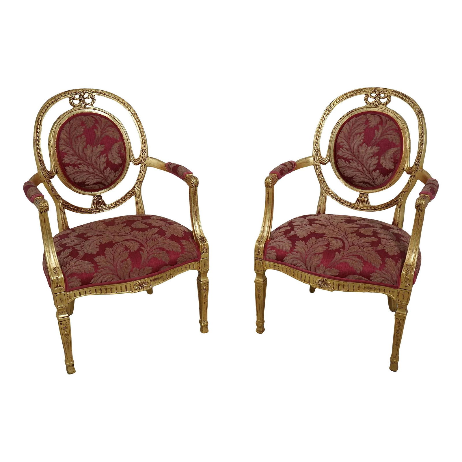 Elegant Pair of Gold Leaf French Louis XVI Open Armchairs: Elegant Pair of Gold Leaf French Louis XVI Open Armchairs This elegant pair of French Louis XVI style open armchairs showcases a stunning gold leaf finish with subtle red undertone highlights, adding