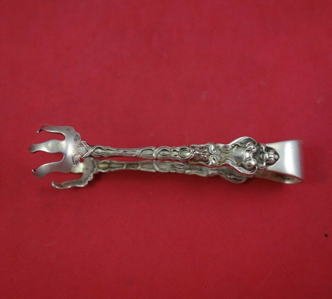 Unger Douvaine Sterling Silver Nouveau Sugar Tong 4 1/4" Serving Piece: Unger Douvaine Sterling Silver Nouveau Sugar Tong 4 1/4" Serving Piece Enhance your serving collection with this exquisite Douvaine sugar tong by Unger, crafted from high-quality sterling silver. Meas