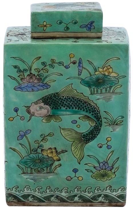 Handmade Square Porcelain Tea Jar Fish Motif Chinoiserie Style: Handmade Square Porcelain Tea Jar Fish Motif Chinoiserie Style Discover this exquisite Traditional Square Porcelain Tea Jar, beautifully crafted in the Chinoiserie style. The jar features a charming f